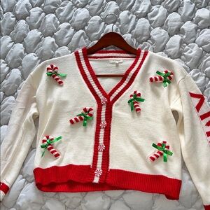 Festive Red and White Sweater with Candy Cane Accents